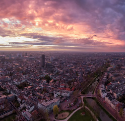 Fototapeta na wymiar Aerial of Utrecht historic city center with the Dom church during impressive sunset with fire colour clouds