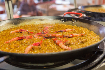 Amazing paella pan cooking on fire