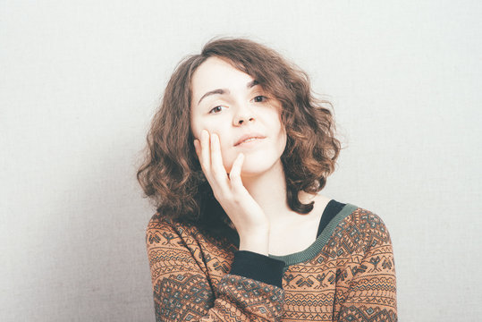 woman, put her hands to the face