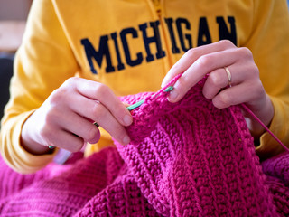 woman hands knitting, crocheting