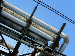 A fragment of a pipeline against the blue sky.