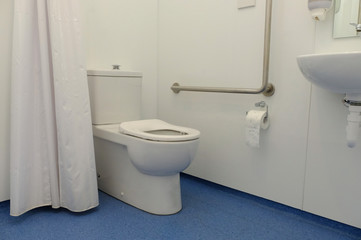 Bathroom interior with new ceramic toilet bowl
