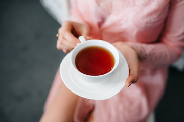 Tea drinking black tea with porcelain cups and a teapot