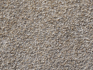 The wall is decorated with small beige stone.