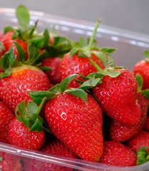 Close up of fresh strawberries in plastic box