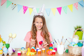 Happy easter. Beautiful little kid wearing bunny ears on Easter day.