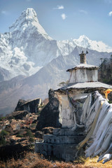 Buddhist Chorten and Ama Dablam High in Himalayan Mountains