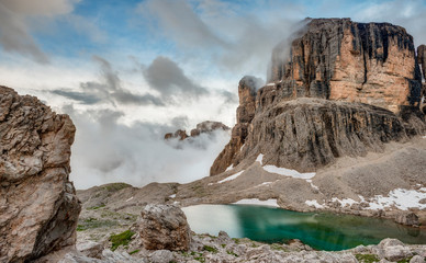 Low Clouds cover Staggering Peaks in the Dolomite Mountains of Italy
