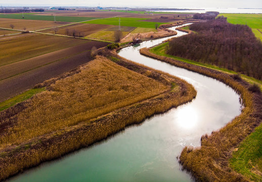 Italy,?Friuli?Venezia?Giulia, Marano, Aerial view of Venetian Lagoon and countryside fields in autumn