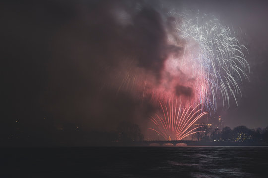 Germany, Hamburg, Fireworks exploding over Outer Alster Lake at night