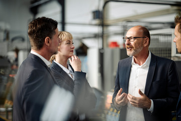 Business team having a meeting in a factory