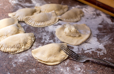 Ukrainian dumplings also called pirogi, are  home made and stuffed with a ricotta cheese filling 