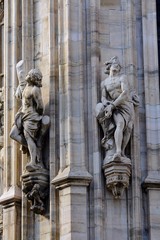 Fototapeta premium Cathedral of the Nativity of the Virgin Mary in Milan. Cathedral of white marble. The Late Gothic building contains many spiers and sculptures, marble peaked towers and columns.