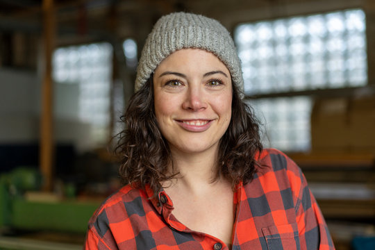 Portrait of confident craftswoman in her workshop