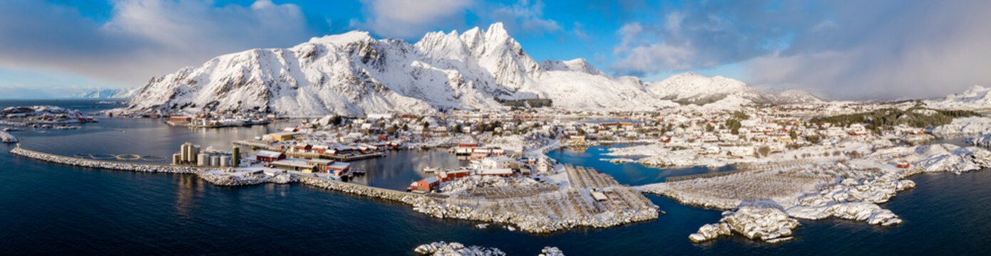Norway, Ballstad, Aerial panorama of fishing village on shore of?Vestvagoya?island with mountains in background