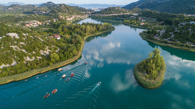 Aerial view of traditional boat race on Bacina lakes in Dalmatia, Croatia.