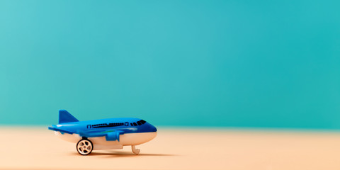 Airplane miniature mockup. Small aircraft, copy space. Air transportation. Airline service. Travelling tourism concept