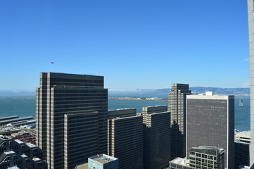 Aerial view of buildings in the San Francisco Financial District and the Bay. 