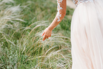 dress up the bride in a wedding dress with corset and lacing