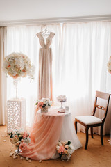 dress up the bride in a wedding dress with corset and lacing