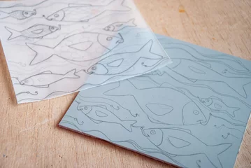 Fotobehang Linocut preparation, drawing transfer trough a tracing paper © Monica