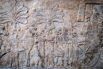Ancient persian bas-relief depicting a marching army