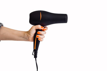 Black hair dryer in hand, close-up, white isolated background.