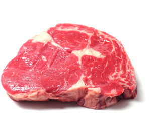 Fresh uncooked rib eye steak on a white surface, Premium cat of beef, Meat industry product.