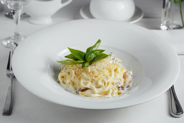 Spaghetti carbonara pasta.Italian cuisine on a serving table