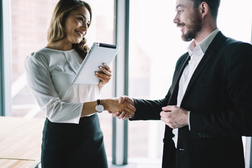 Office worker shaking hands with male entrepreneur