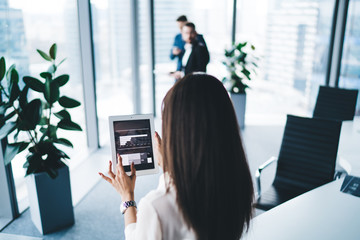 Modern woman using tablet at office
