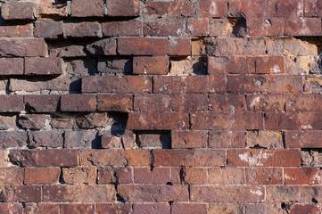 background texture of a destroyed wall of old red brick