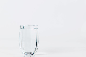 Glass with water on a white background. Glass of mineral water on white background.