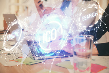 Double exposure of woman hands typing on computer and crypto market theme hologram drawing....