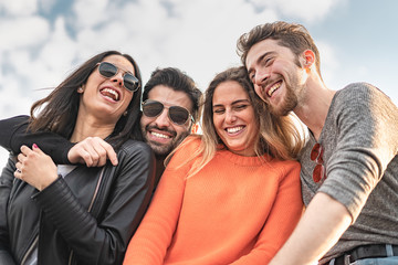 group of happy friends smiling outdoors