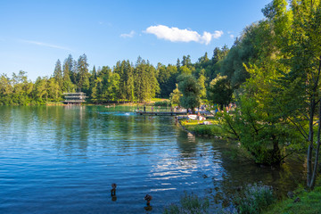 People relax on the shores of Lake Bled, Slovenia