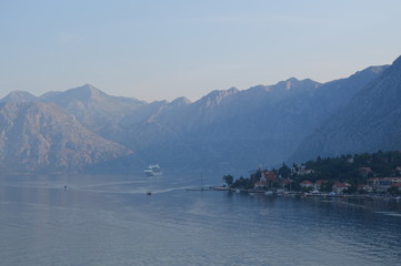 Mountainous Valley Surrounding The Adriatic And Cruise Ship