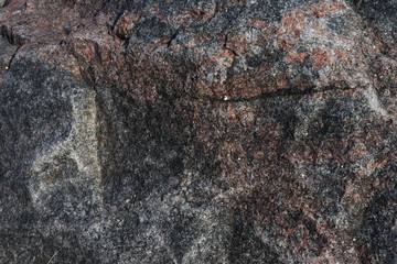 Stone wall as a background.Decorative natural stone. Natural decoration of the facade of the house, building