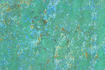 Light green cracked paint on a metal surface with rust elements. Average plan
