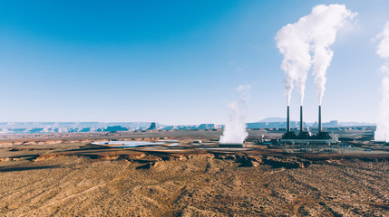 Panoramic view of industrial plant with steam towers dangerous for ecology and environment producing radioactive pollution, nuclear power station generating electricity from uranium