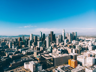 Obraz premium High skyscrapers and buildings in modern megalopolis with infrastructure and traffic at sunny day, modern urban setting view of towers and real estate for business and residents in finance district