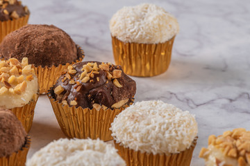 Brigadeiro is a common Brazilian dessert. Delicious chocolate candy Brigadeiro on a table