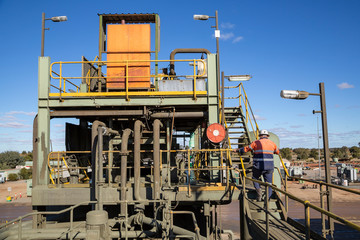 Miner ascending stair of a copper processing mine head in NSW Australia