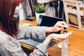 Obraz premium Business young woman working from home office he quarantines disease coronavirus or COVID-19