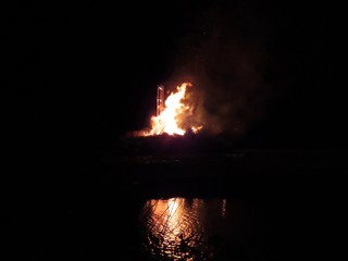 Bonfire and reflection in water