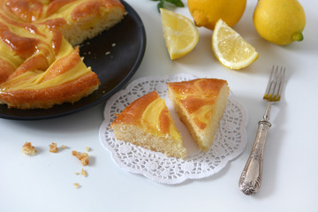portion of lemon pie on the white table - closeup