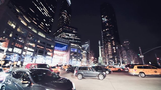 NEW YORK CITY - DECEMBER 2018: Columbus Circle night traffic in Manhattan in slow motion, New York City, USA