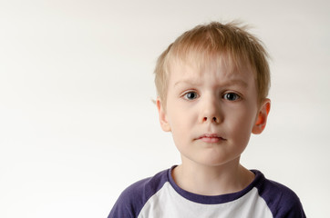 kid boy over isolated white background afraid and shocked with surprise expression