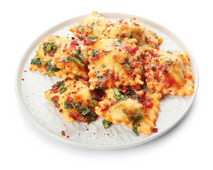 Plate with tasty ravioli on white background