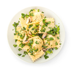 Plate with tasty ravioli on white background